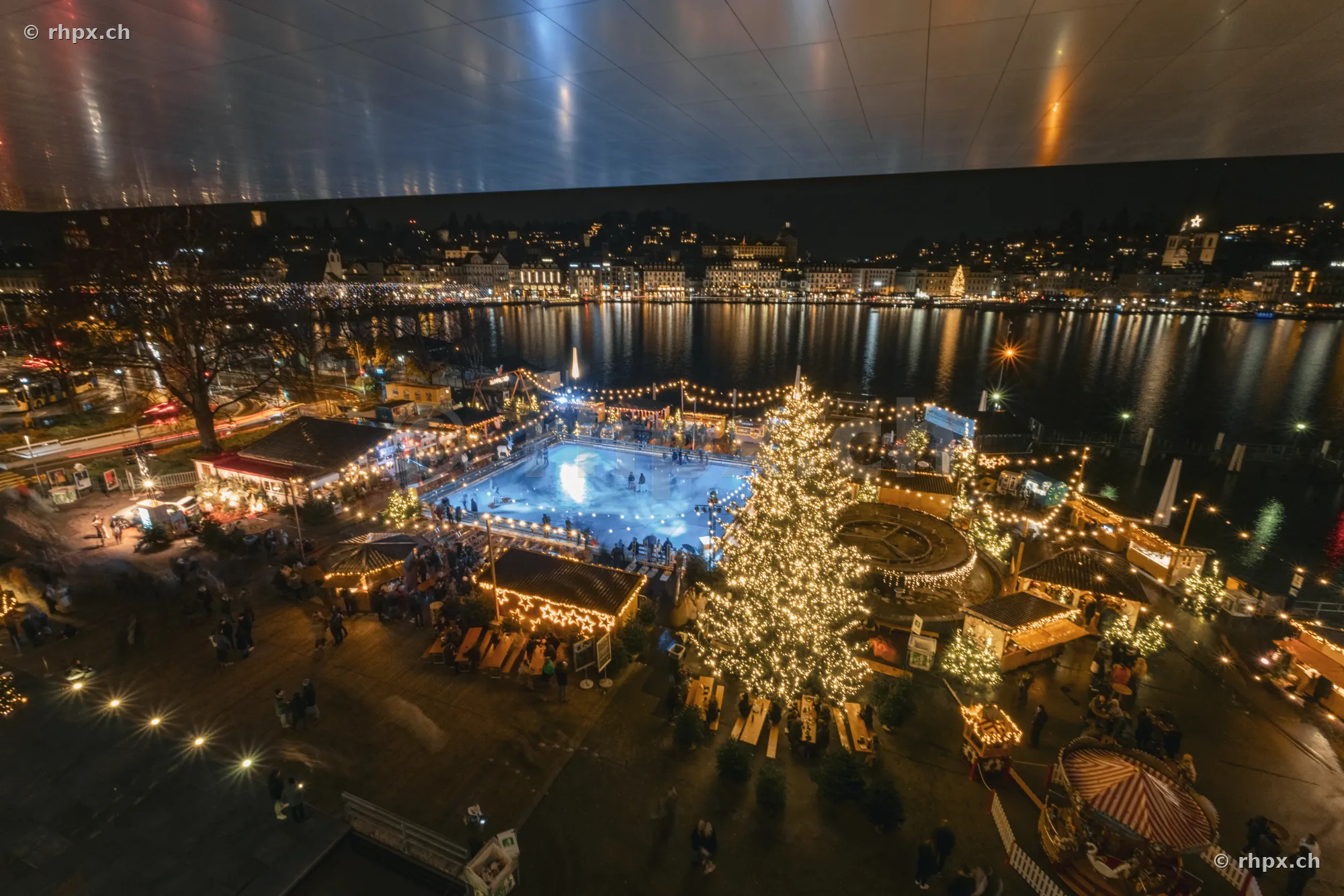 Night view of the ice rink and Christmas tree at Europaplatz in front of Lake Lucerne