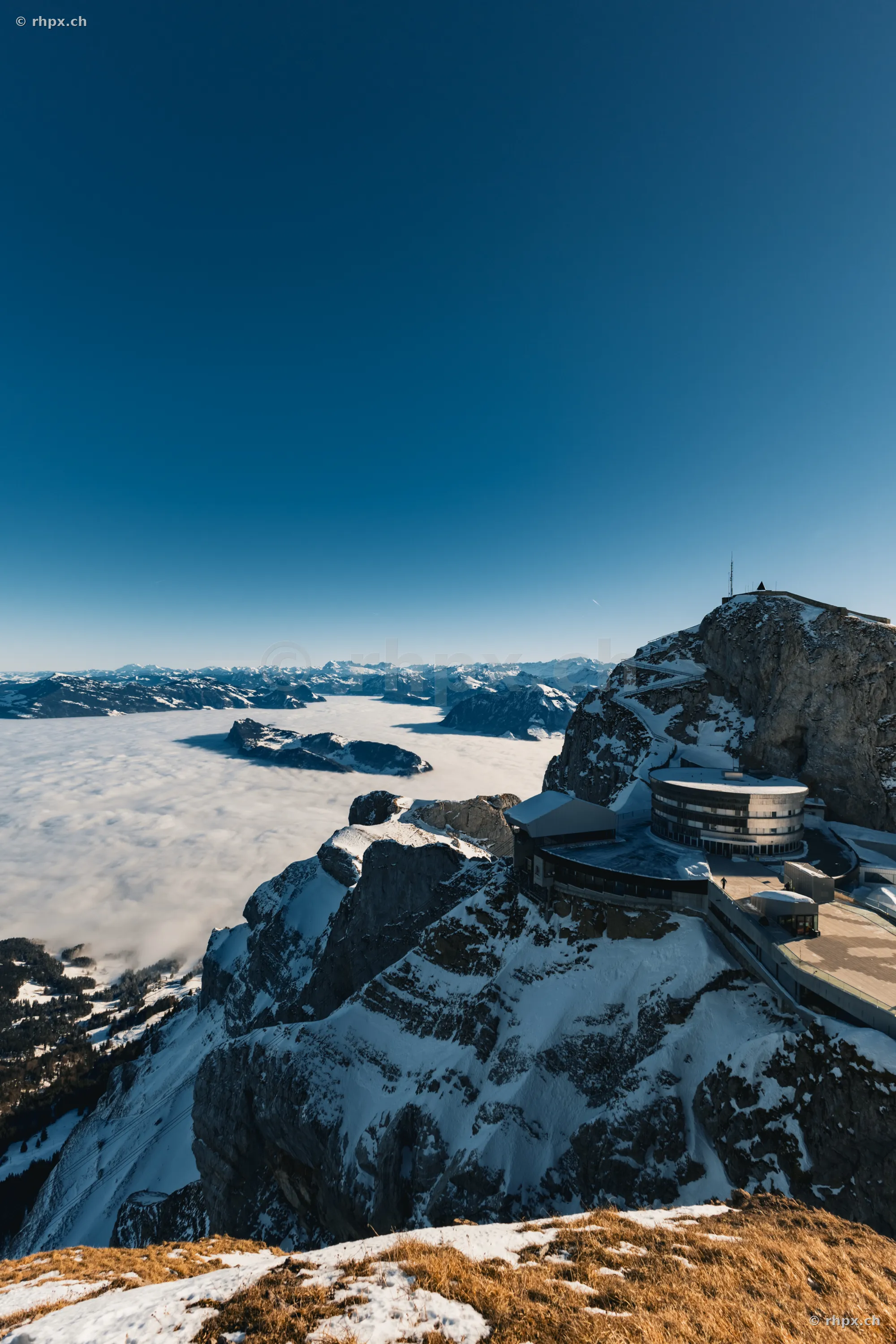 Aerial view of Pilatus Kulm overlooking a sea of clouds