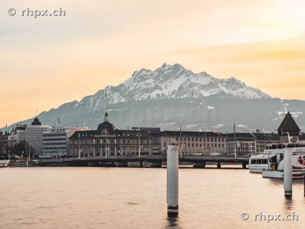 View across the Reuss river to the city of Lucerne with the snow-covered Mount Pilatus in the background