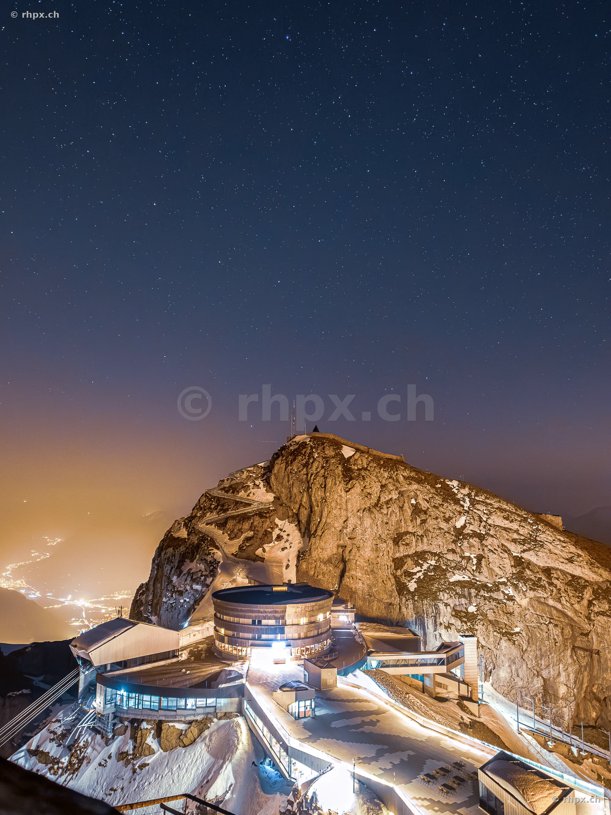 View of Pilatus Kulm at night under a starry sky