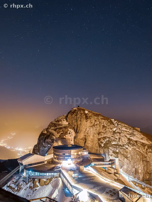 View of Pilatus Kulm at night under a starry sky