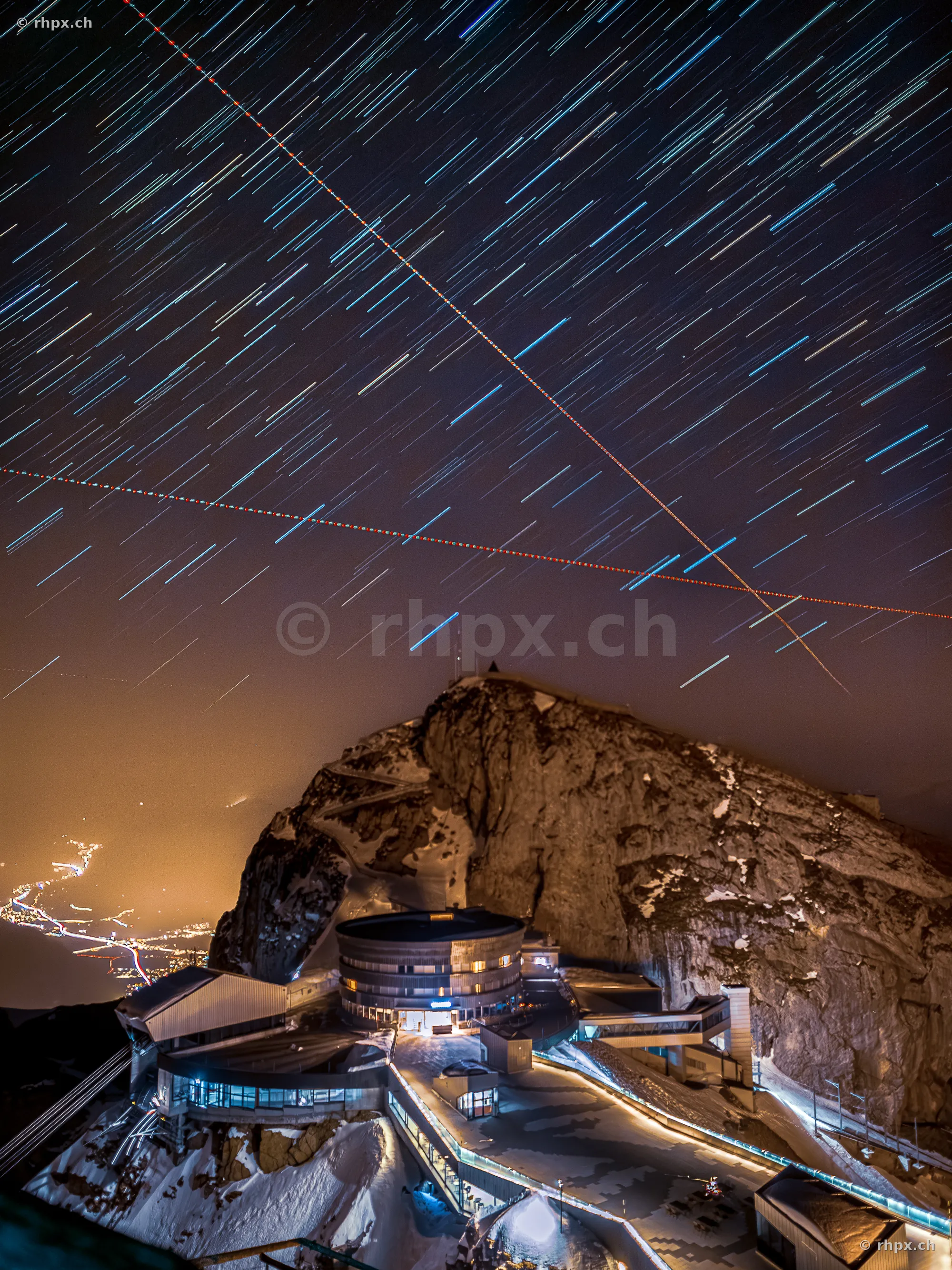Long exposure of star trails over the night summit of Mount Pilatus with the Bellevue hotel