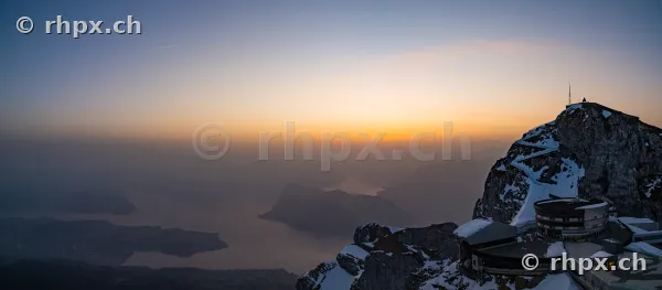 Snow-covered peak of Mount Pilatus in the sunset light overlooking Lake Lucerne