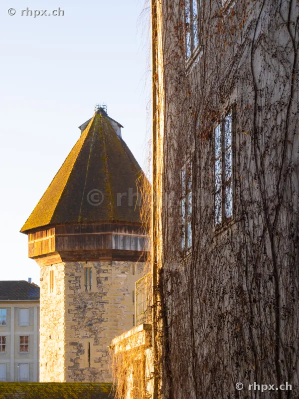 View of the Water Tower of the Chapel Bridge in Lucerne from a narrow alley.