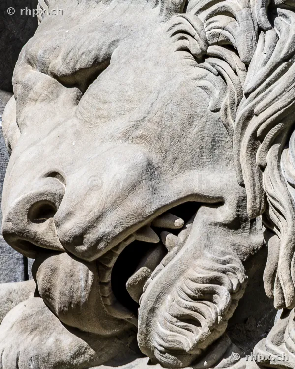 Close-up of the stone lion figure of the Lion Monument in Lucerne