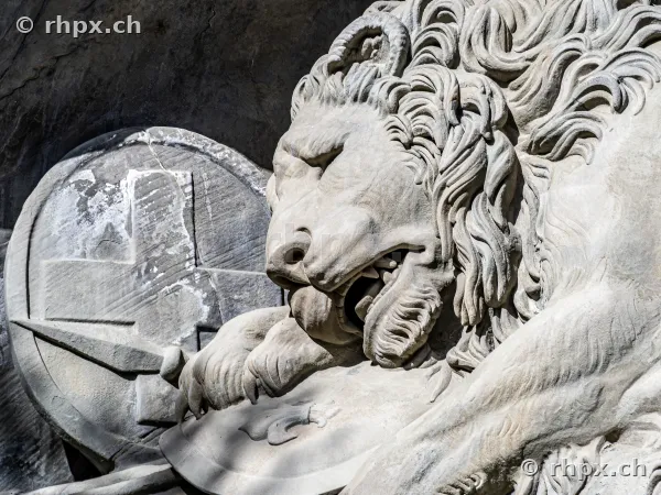 Close-up of the Lion Monument with Swiss coat of arms in Lucerne