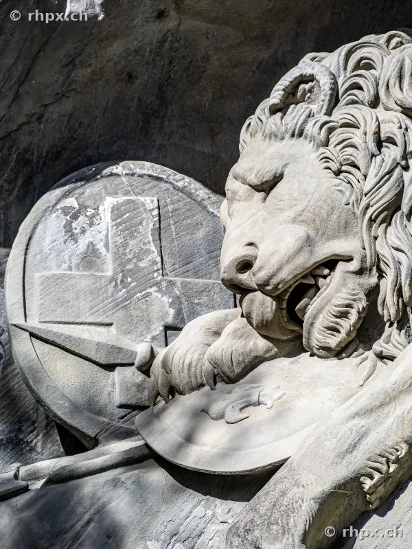 Detailed view of the dying lion sculpture at the Lion Monument in Lucerne