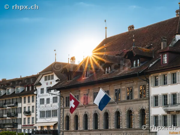 Luzern town hall with sun rays behind the roof gable