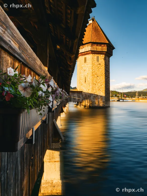 Water tower of the Chapel Bridge in Lucerne in the soft light of the evening sun