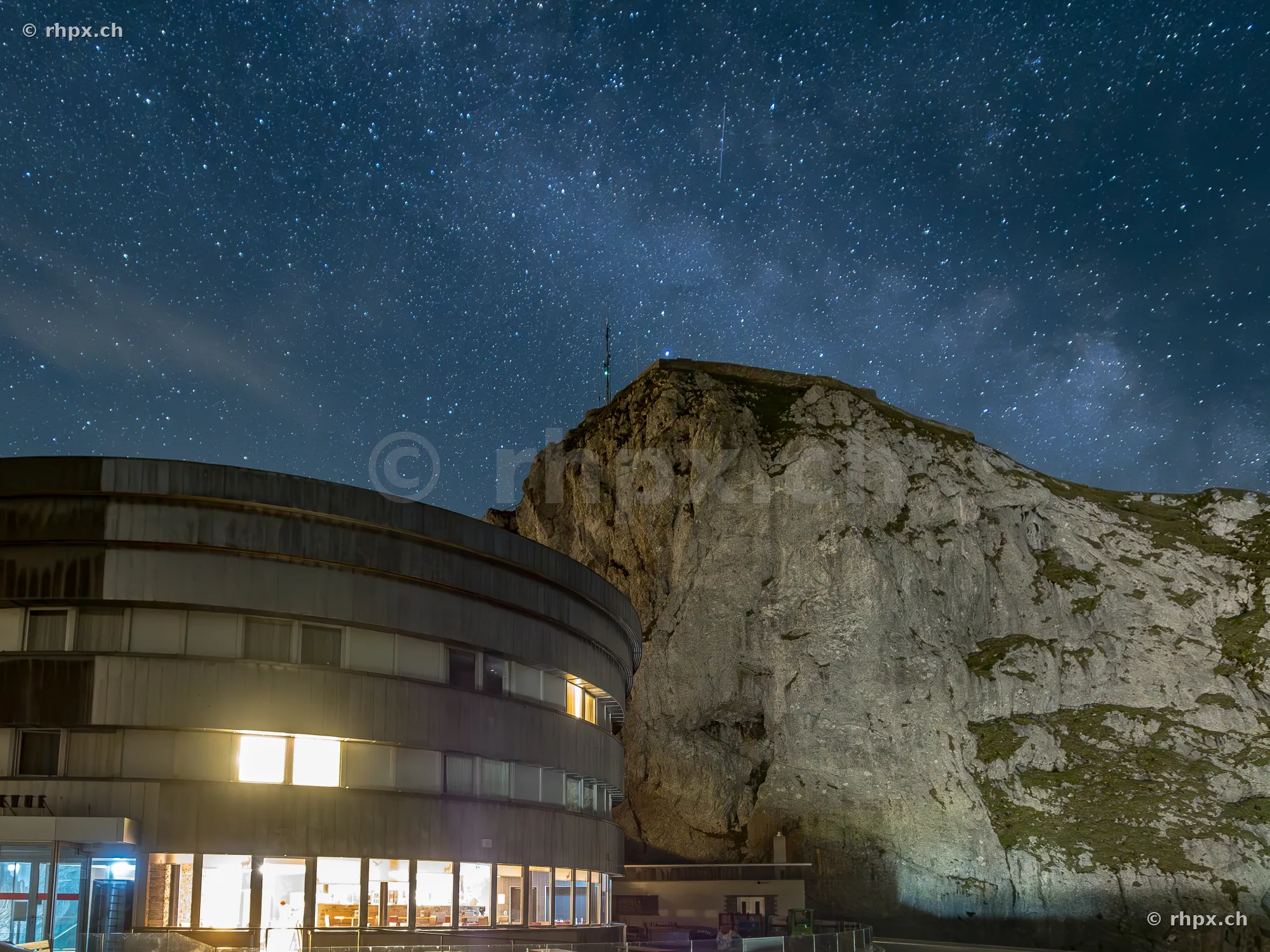 Pilatus-Kulm hotel at night under a clear starry sky
