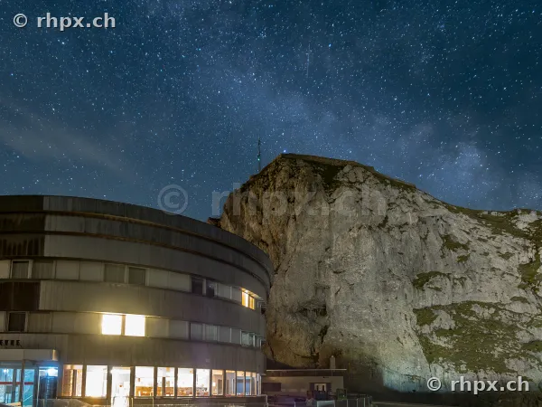 Pilatus-Kulm hotel at night under a clear starry sky