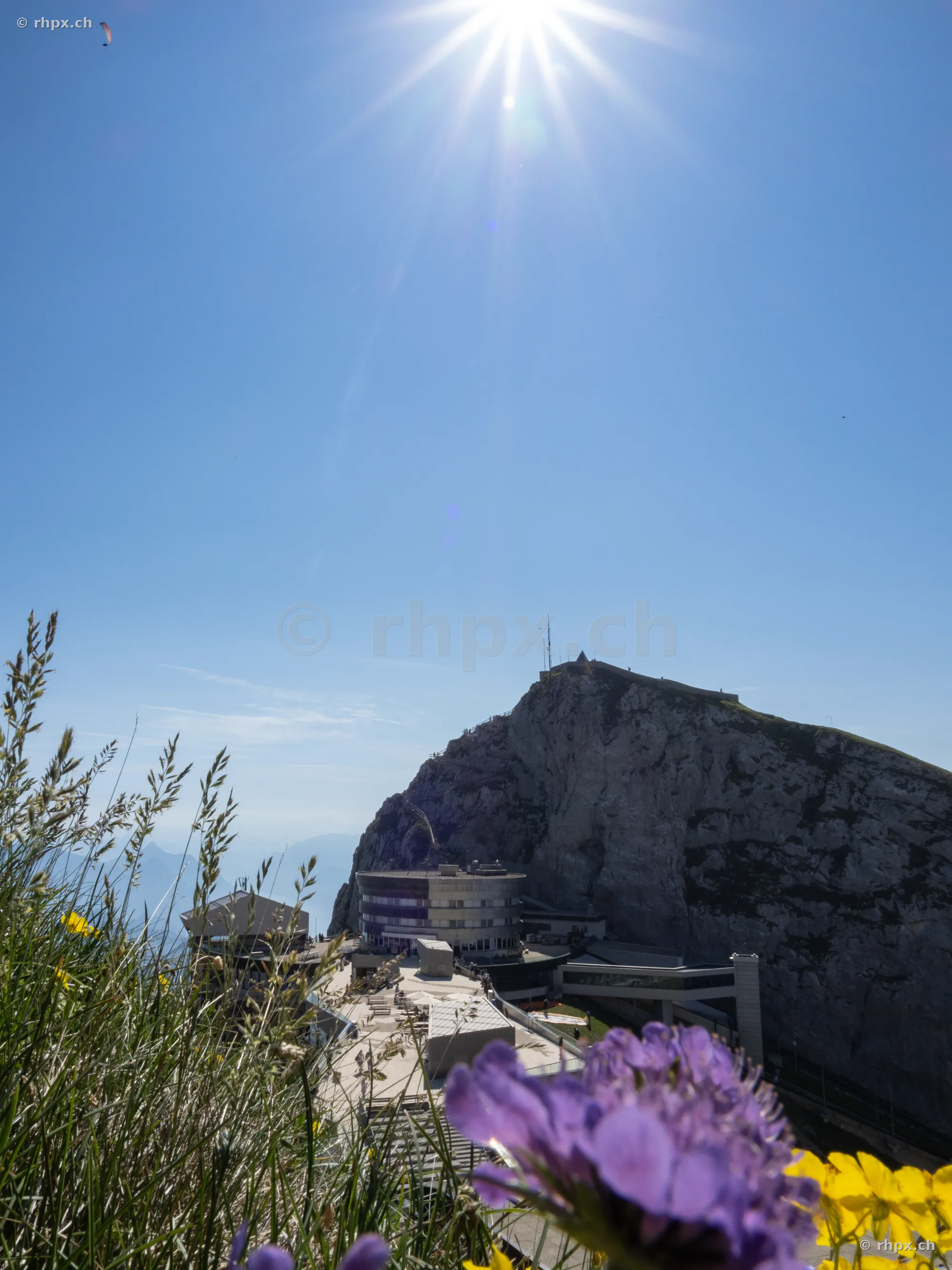 View of the Pilatus mountain station under a clear blue sky