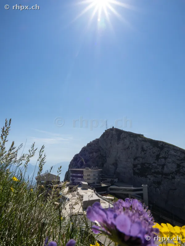 View of the Pilatus mountain station under a clear blue sky