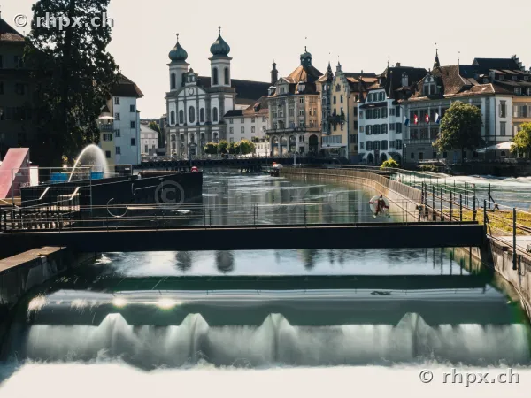 View of the Reuss weir with the Jesuit church in the background in Lucerne
