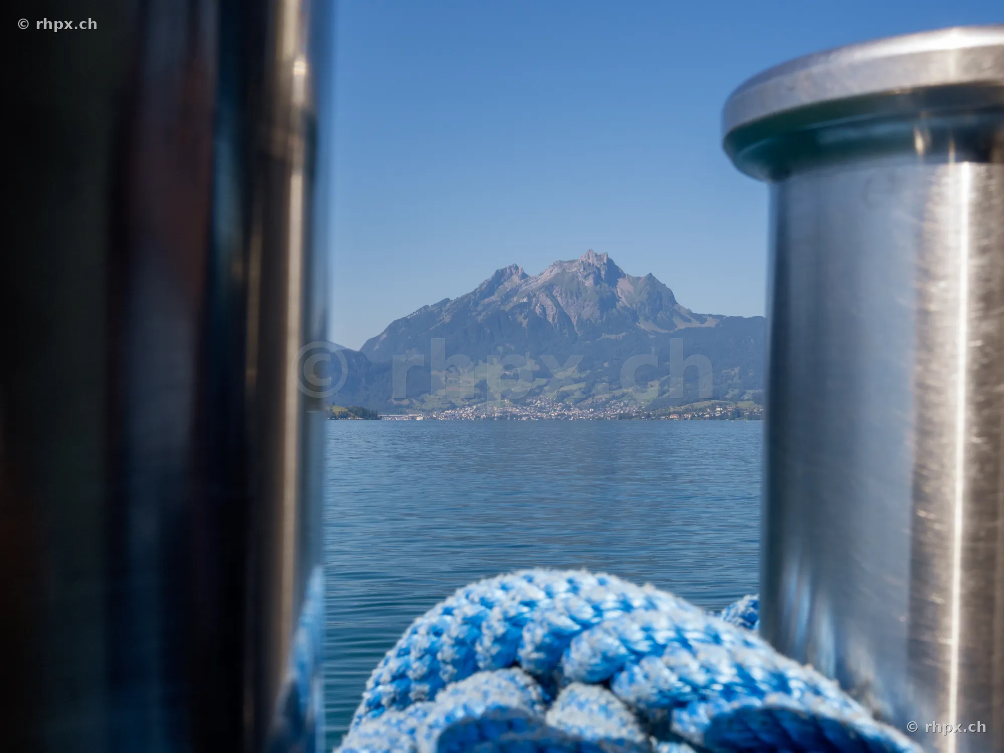 Mount Pilatus over Lake Lucerne framed by boat components