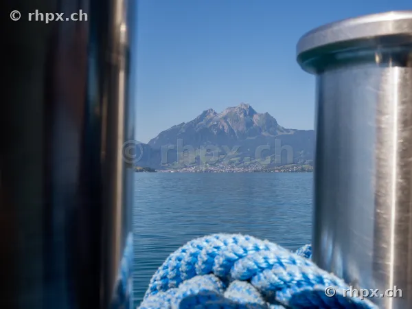 Mount Pilatus over Lake Lucerne framed by boat components