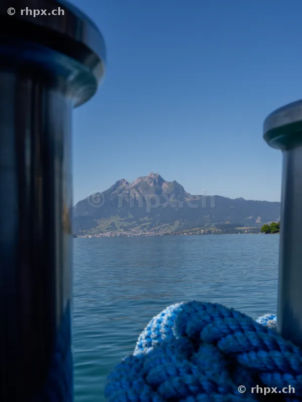 View of Mount Pilatus and Lake Lucerne through two ship bollards