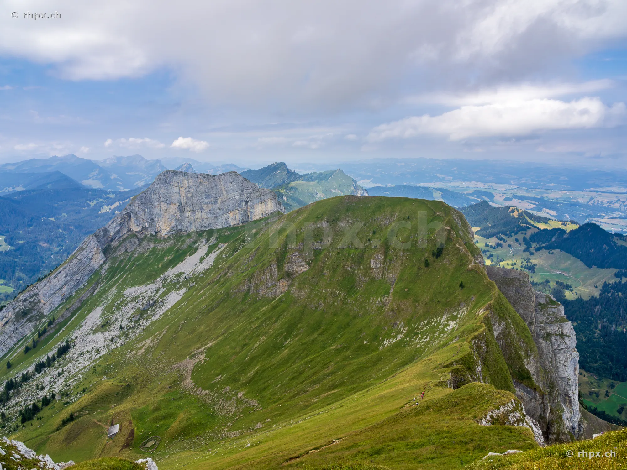 View of the green mountain ridge and steep rock faces of Mount Pilatus in Central Switzerland