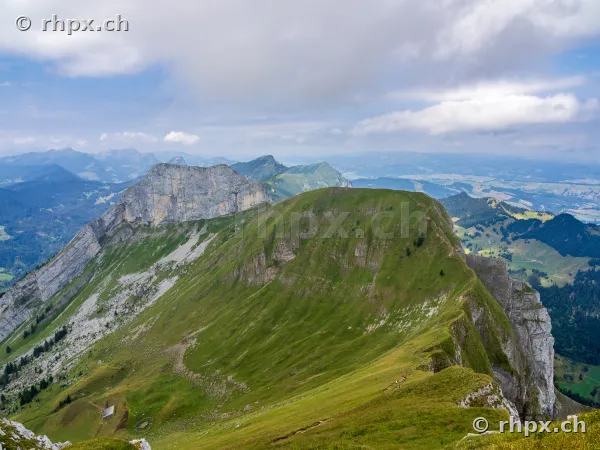 View of the green mountain ridge and steep rock faces of Mount Pilatus in Central Switzerland
