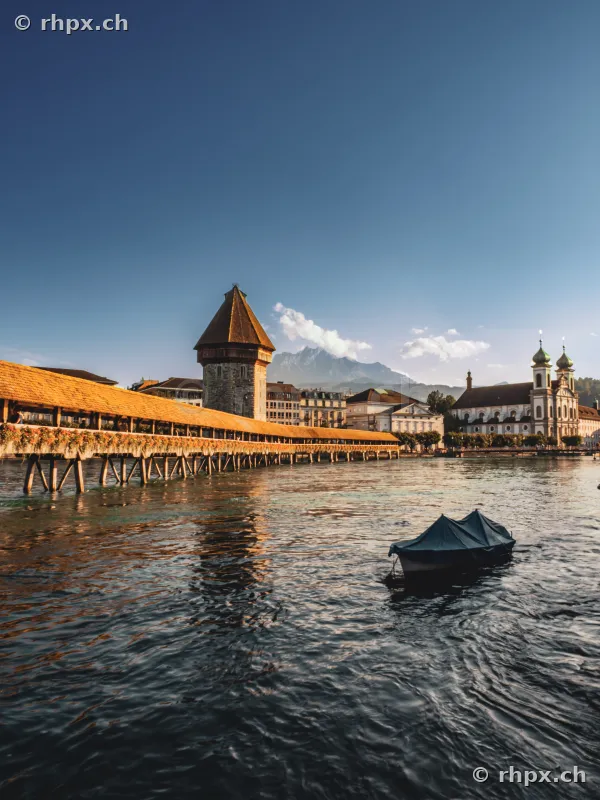 Chapel Bridge and Jesuit Church with Mount Pilatus in the background