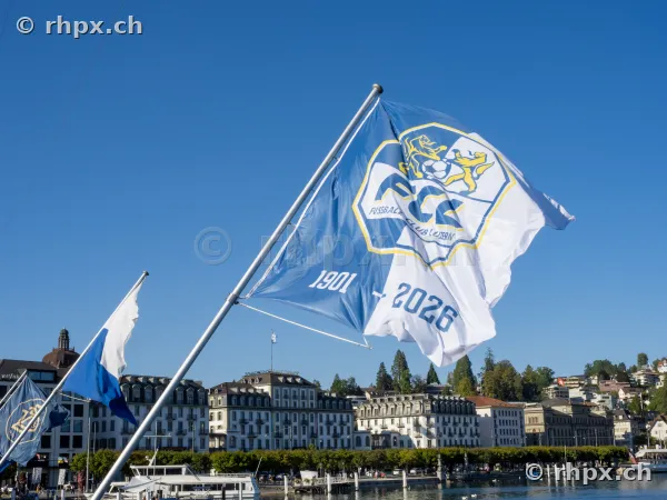 Flags celebrating the 125th anniversary of FC Luzern with Hotel Schweizerhof in the background