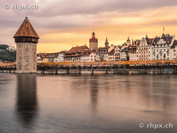 Chapel Bridge and historic buildings of Lucerne Old Town at dusk