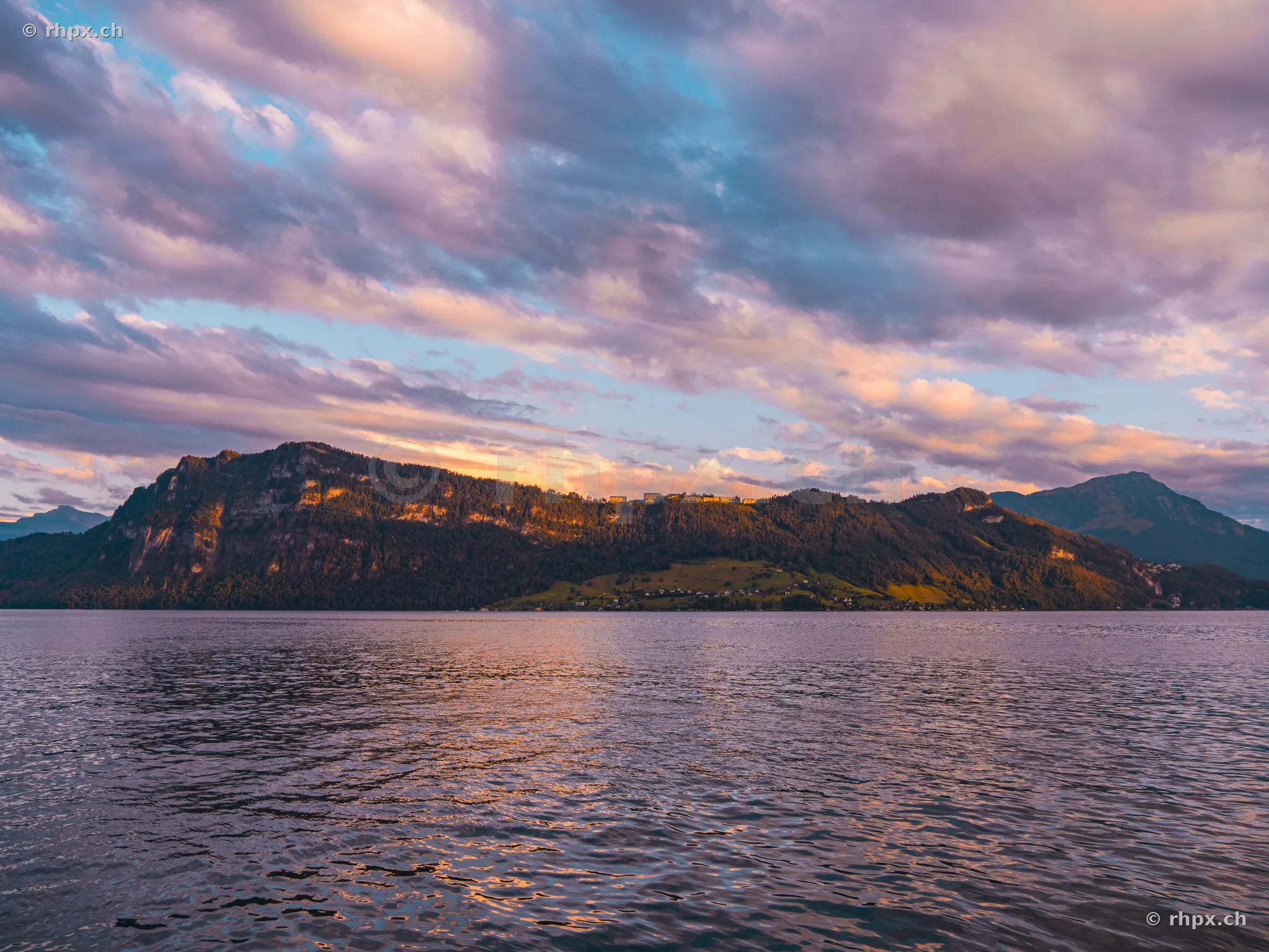 Bürgenstock mountain ridge over Lake Lucerne in violet evening light