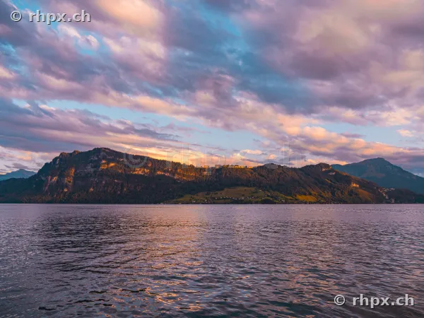 Bürgenstock mountain ridge over Lake Lucerne in violet evening light