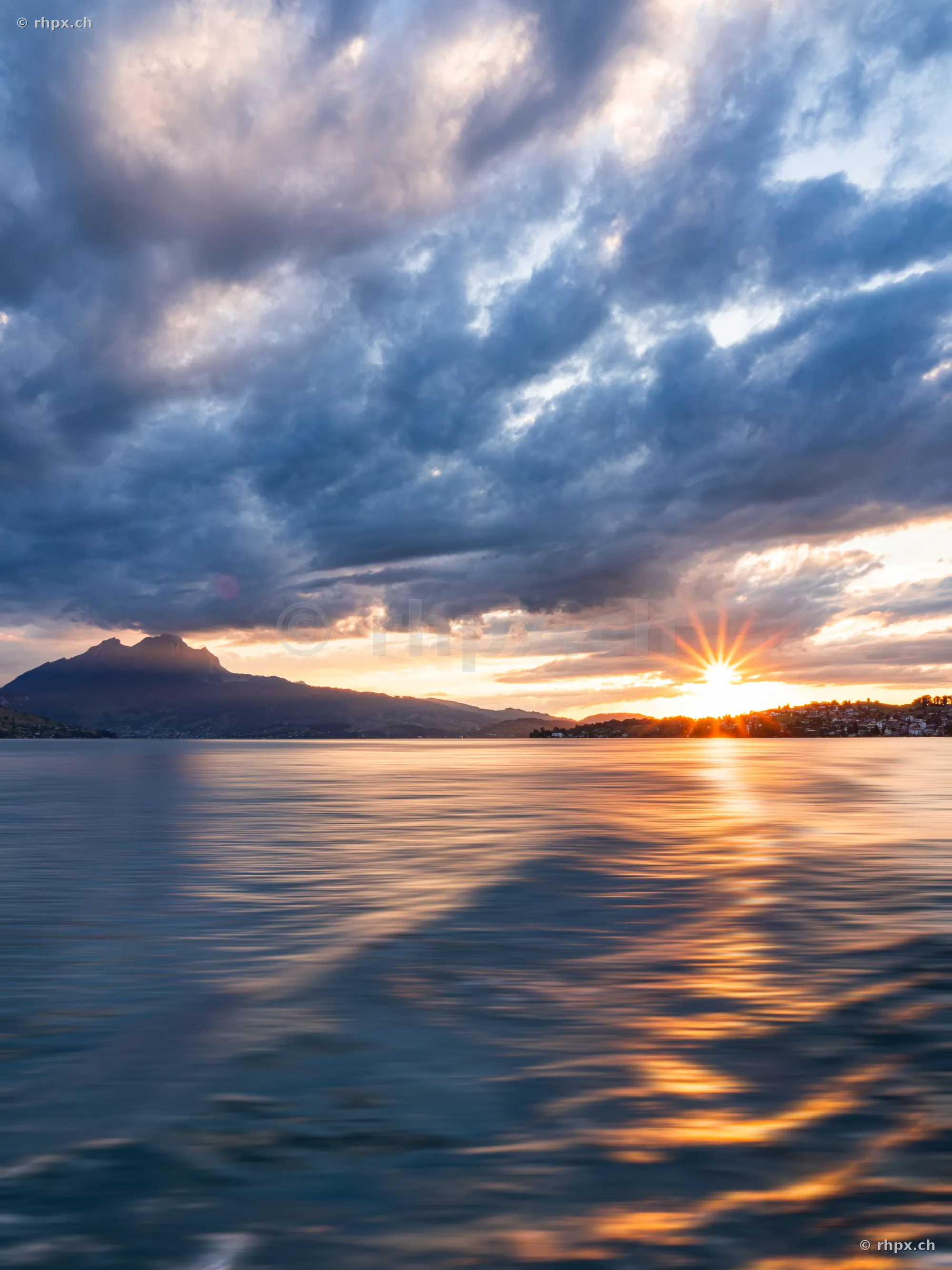 View across Lake Lucerne towards Mount Pilatus at sunset