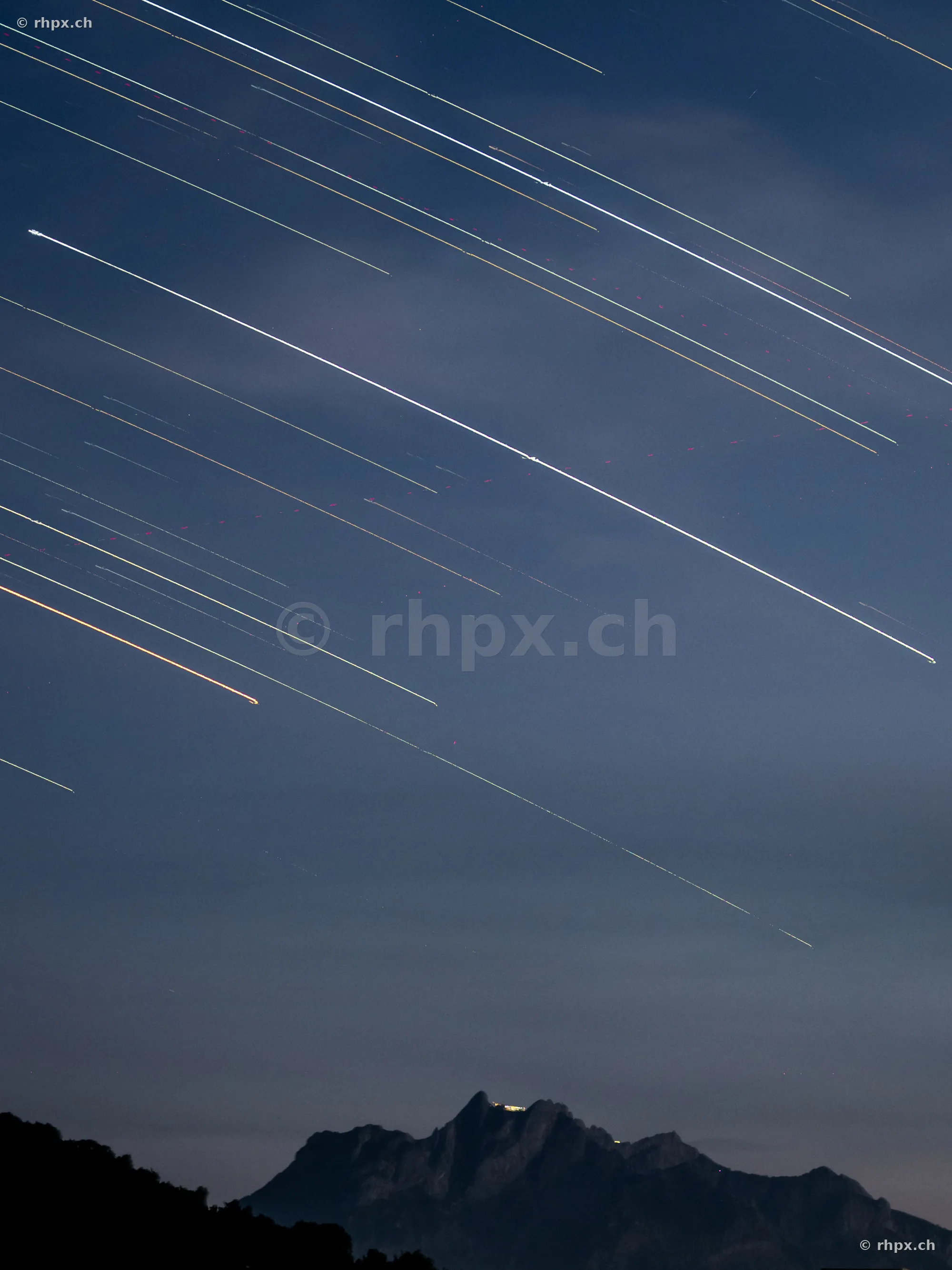 Long exposure of star trails in the night sky over Mount Pilatus near Lucerne