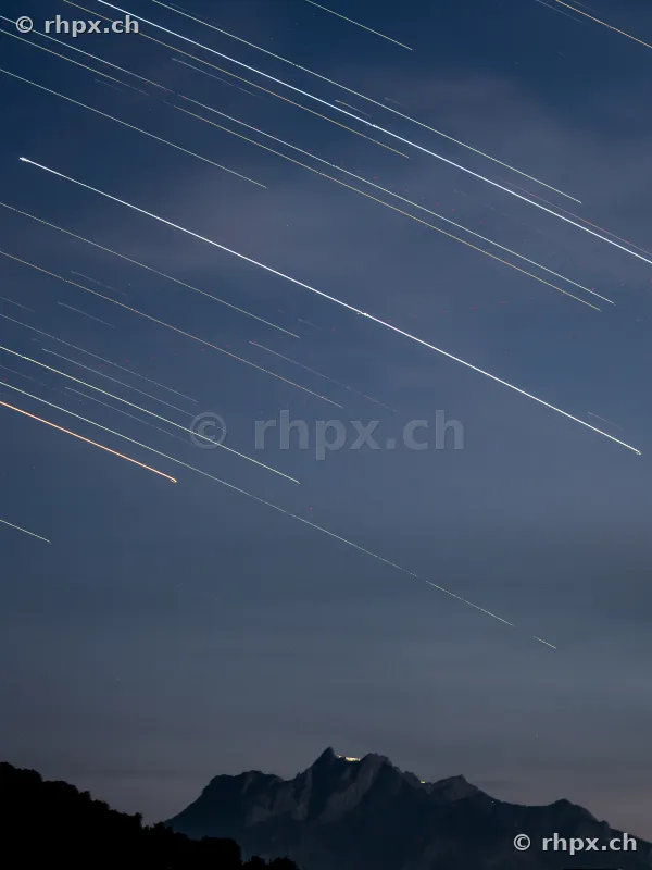 Long exposure of star trails in the night sky over Mount Pilatus near Lucerne