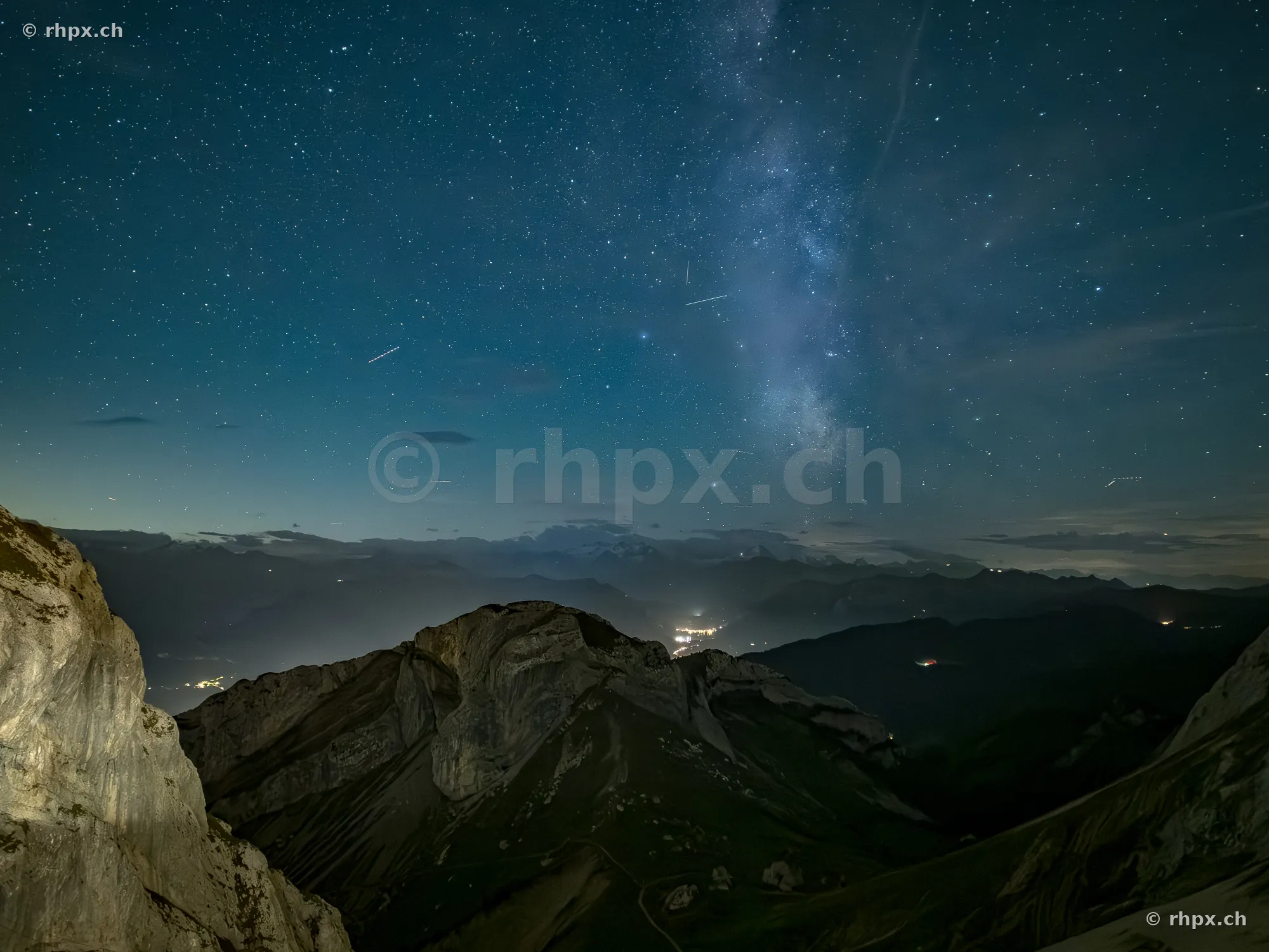 View of the dark silhouette of Mount Pilatus with the Milky Way in the night sky