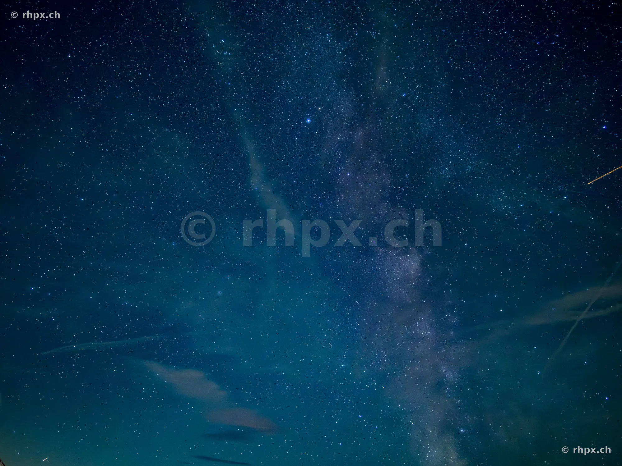 Night sky with the Milky Way above the silhouette of Mount Pilatus