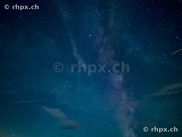 Night sky with the Milky Way above the silhouette of Mount Pilatus