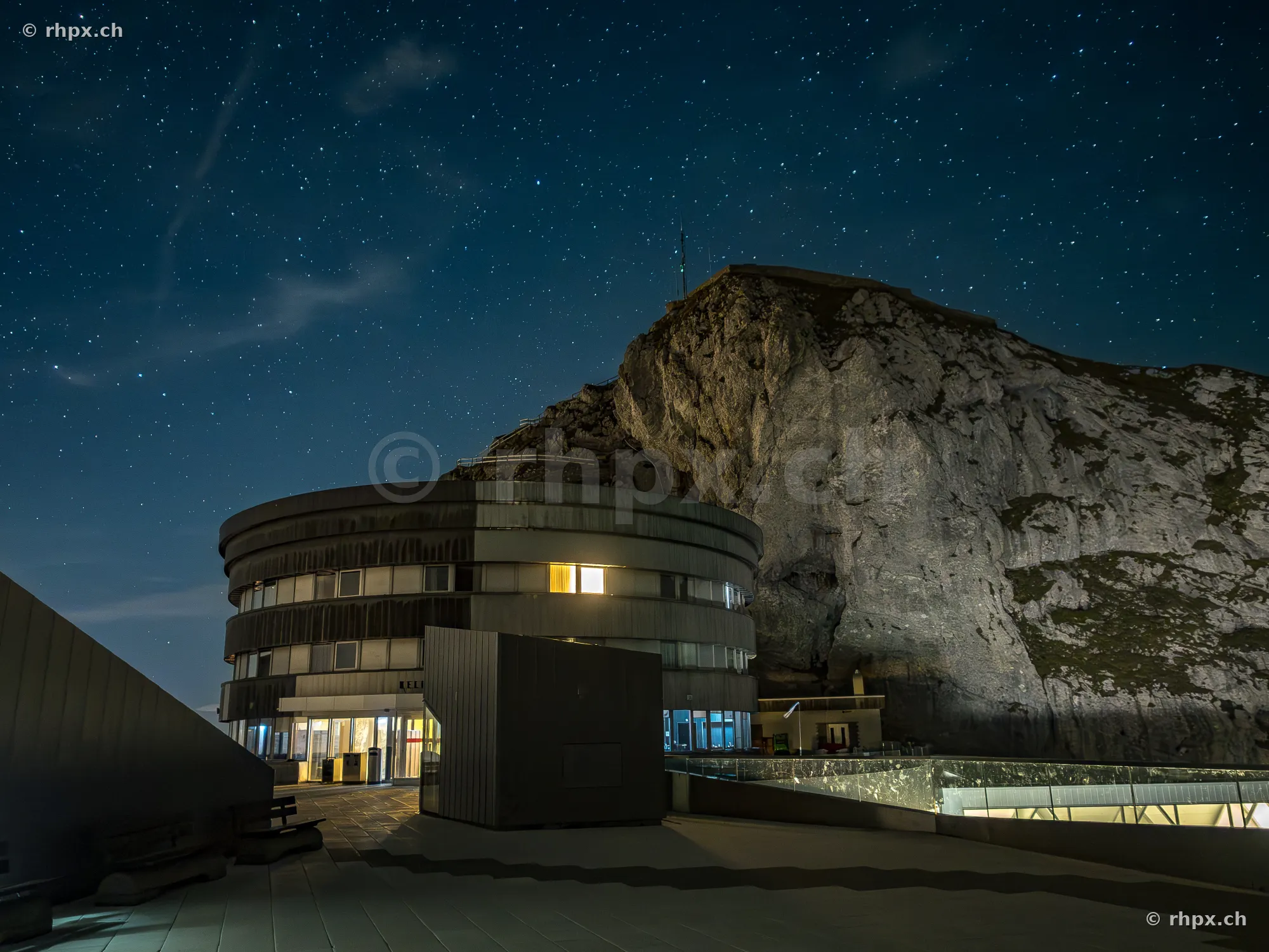 The Hotel Bellevue at Mount Pilatus at night with a starry sky