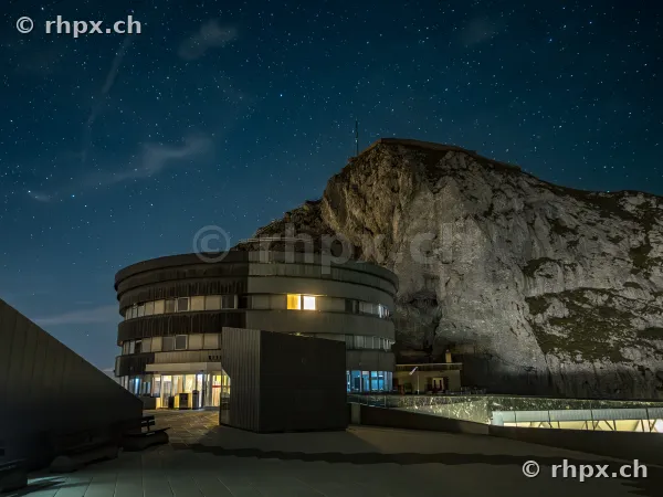 The Hotel Bellevue at Mount Pilatus at night with a starry sky