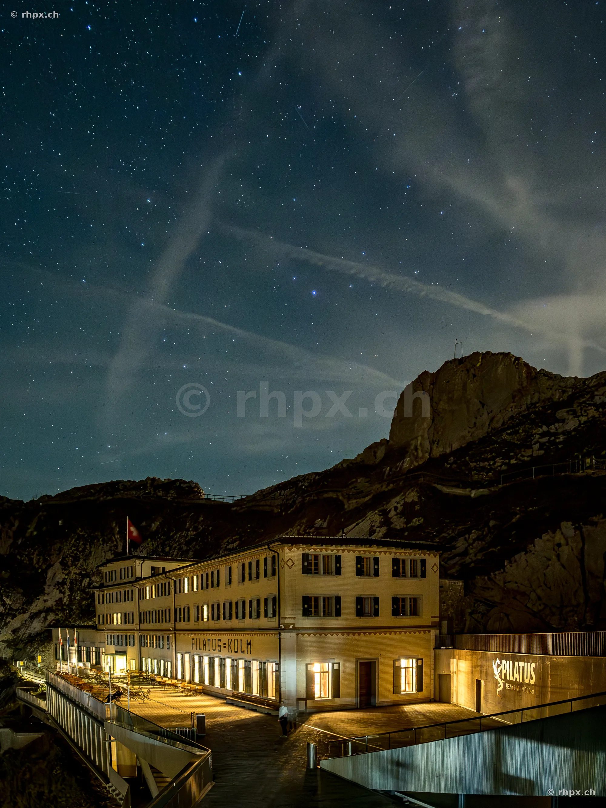 Night view of the Hotel Pilatus-Kulm under a clear starry sky
