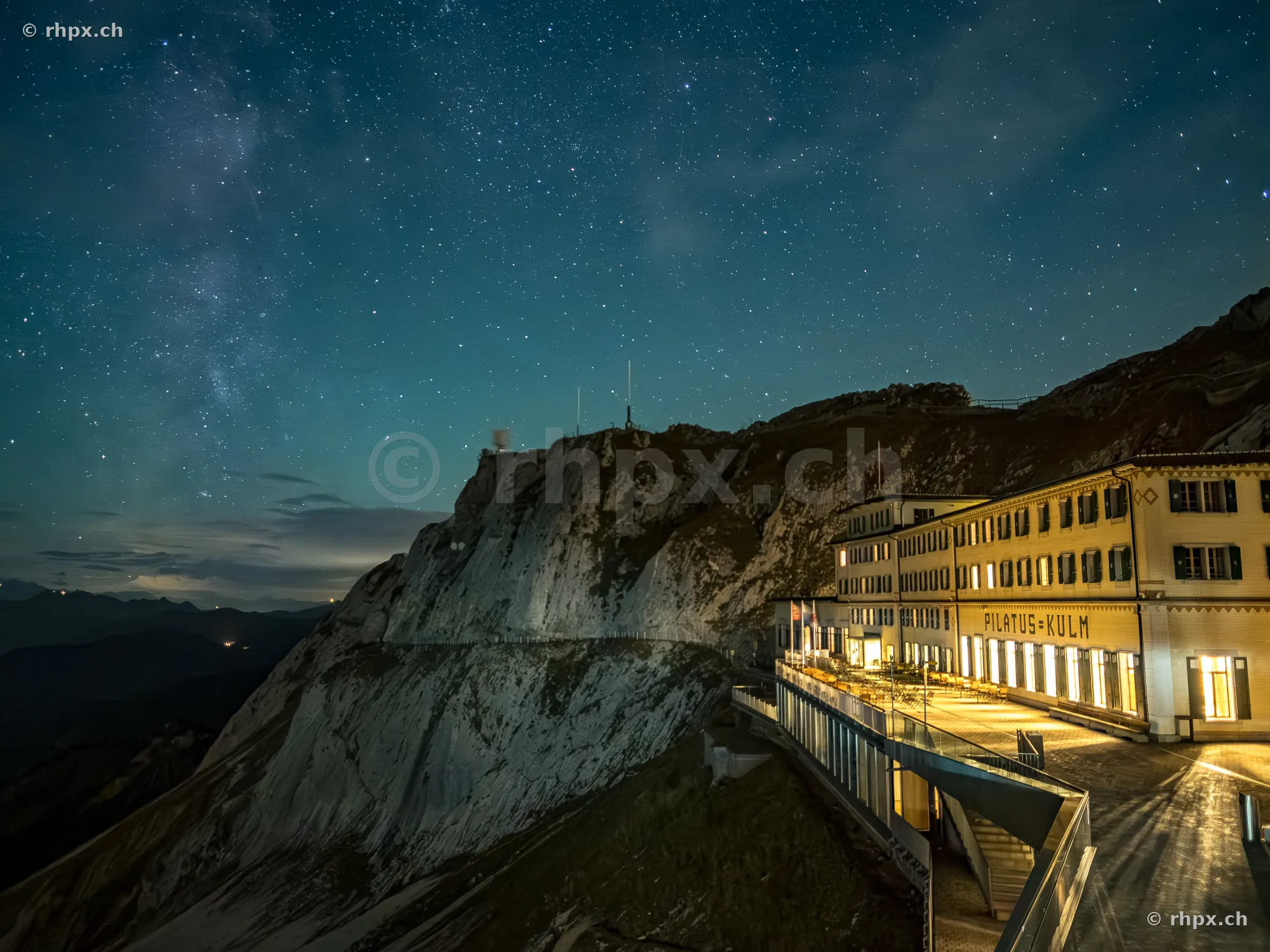 Hotel Pilatus-Kulm at night with a visible Milky Way in the starry sky