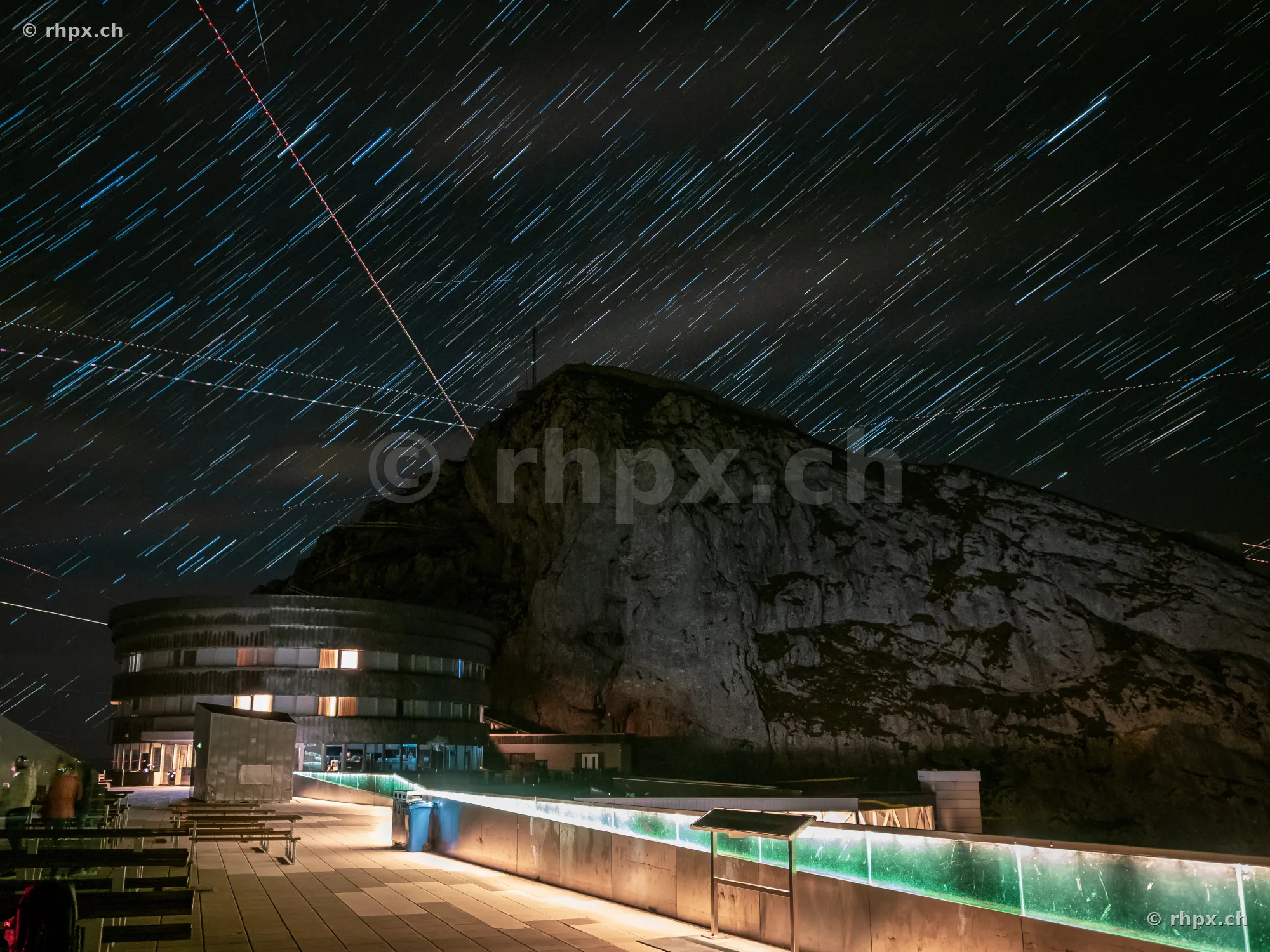 Hotel Pilatus Kulm at night with visible star trails in the sky