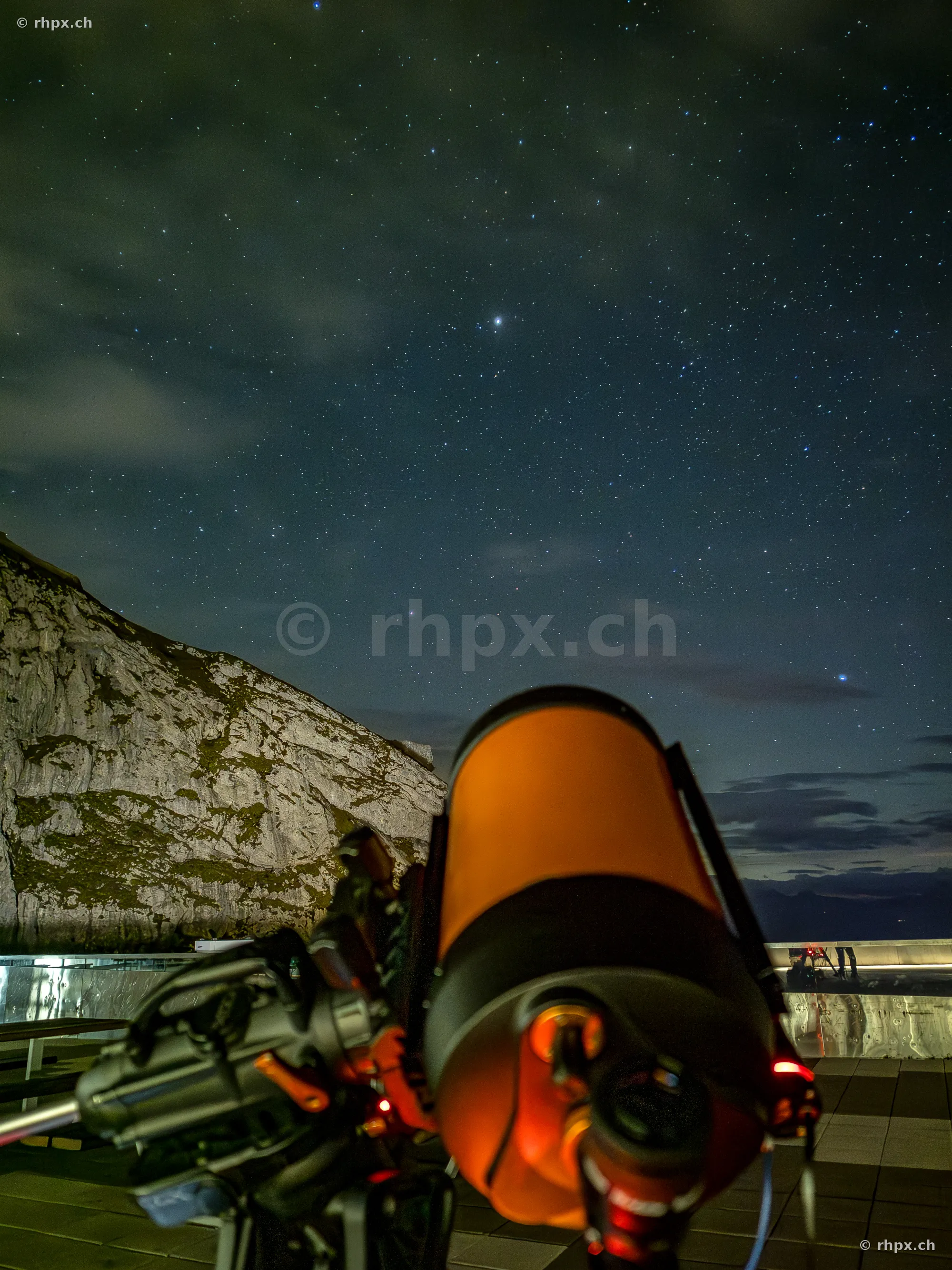 View through a telescope at the night sky on Mount Pilatus