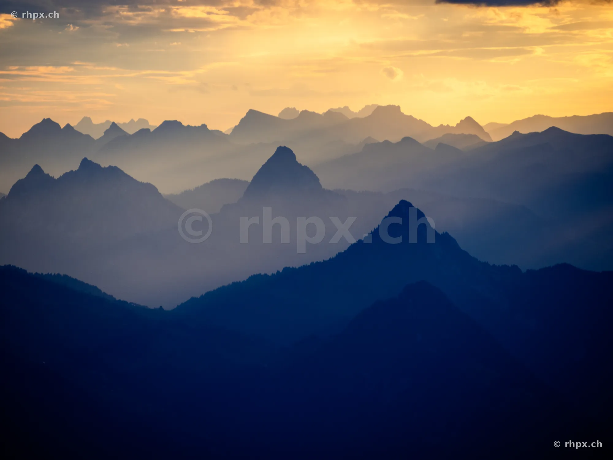 View of the Pilatus and Central Swiss mountain ranges at sunset