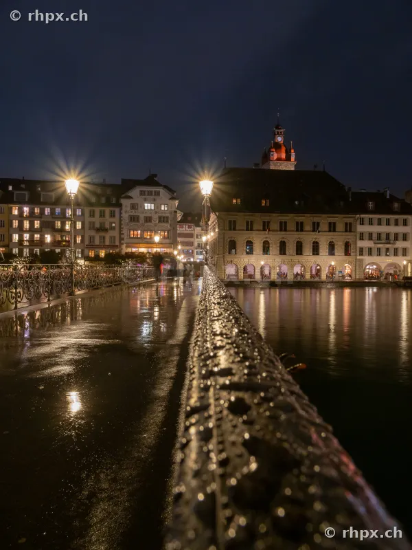 Night shot looking across the Rathausbrücke towards the Lucerne Town Hall and the Reuss river.