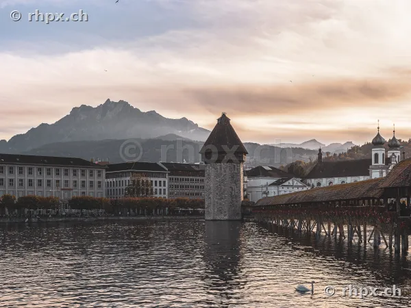 Chapel Bridge with water tower and Mount Pilatus in the background