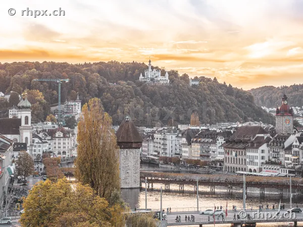Elevated view of Lucerne old town, Chapel Bridge and Chateau Gütsch in the evening light