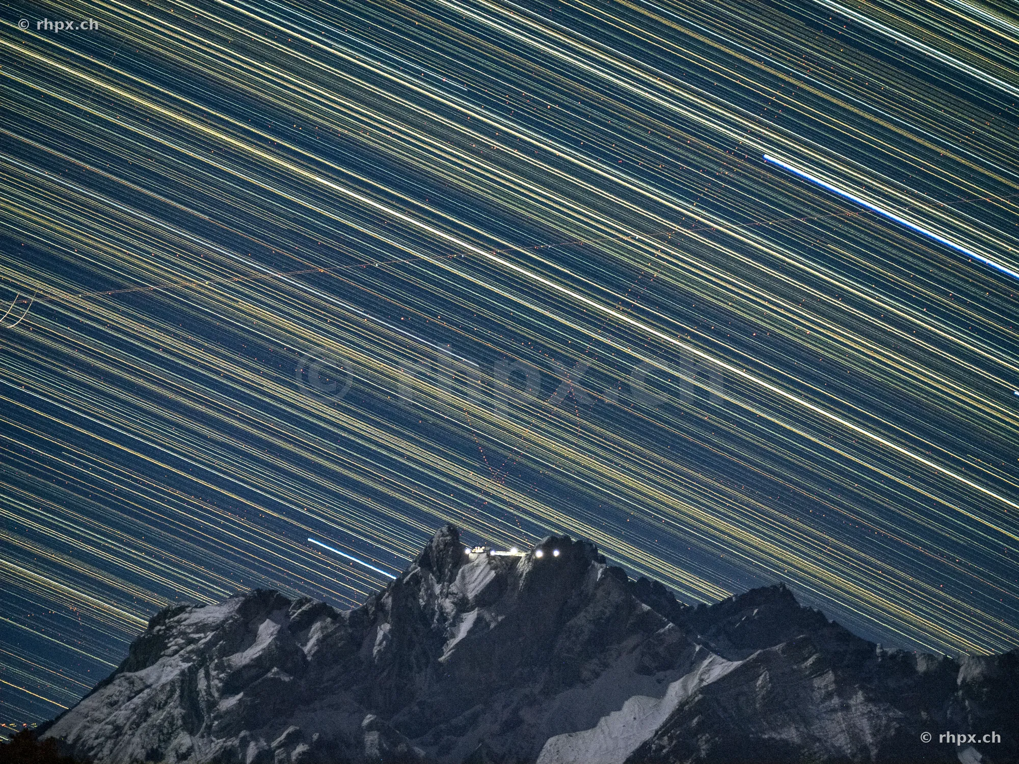 Star trails over the Pilatus mountain range at night
