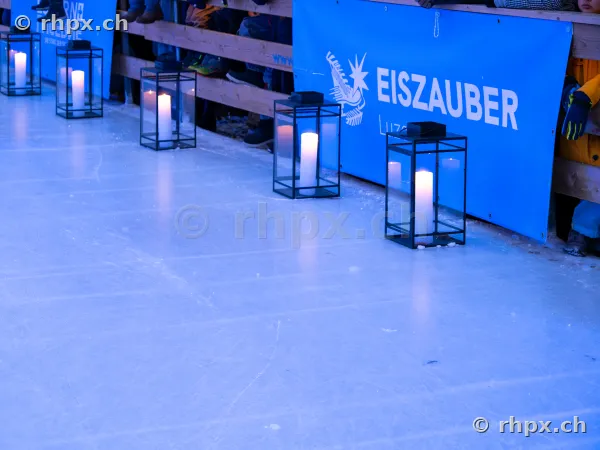 Candles in black lanterns at the edge of the Eiszauber ice rink in Lucerne