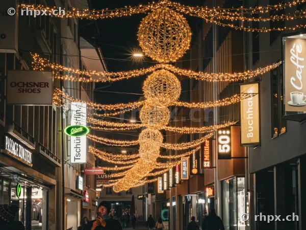 Christmas decorations with glowing orbs in a street of Lucerne's old town