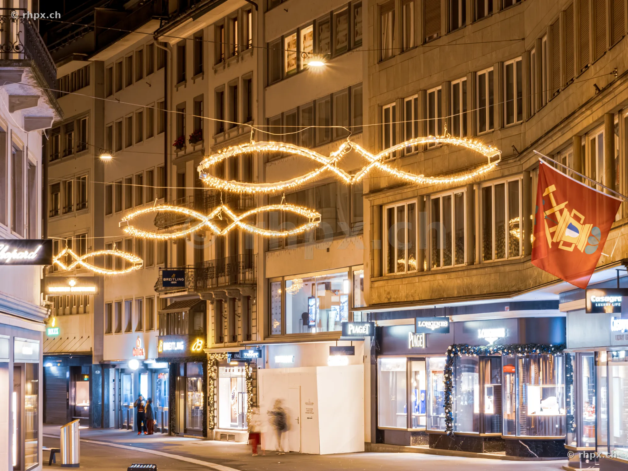 Christmas lights over an empty alley in the old town of Lucerne at night
