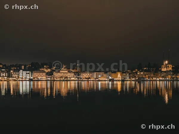 The night skyline of Lucerne with festive lights on Lake Lucerne