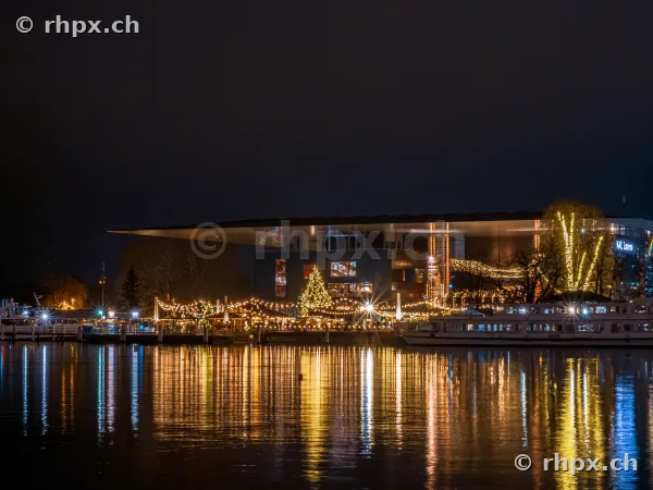 Christmas lights at KKL Lucerne on Lake Lucerne at night
